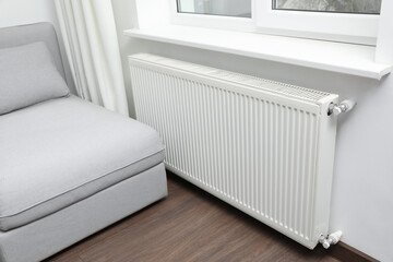 Modern radiator at home. Central heating system