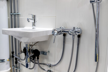 Modern plumbing for bathroom with water and sewer pipes