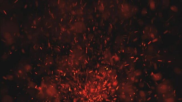 Burning red hot sparks and embers fire background animation. Fiery glowing red sparks exploding upwards. Full HD hot fire particles motion background.