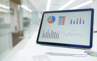 close up business's data dashboard on tablet with performance report on table in office workspace for data management of business financial and economy