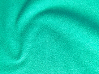 Felt pastel green soft rough textile material background texture close up,poker table,tennis ball,table cloth. Empty green fabric background.