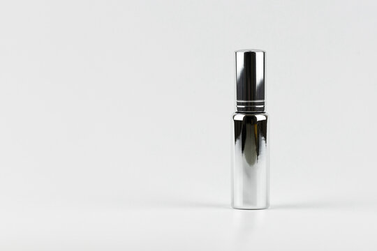 metal sprayer of essence perfume minimal style concept. unbranded perfume aluminium sprayer for your text and design