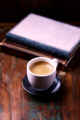 Cup of coffee on rustic wooden background. Copy space.