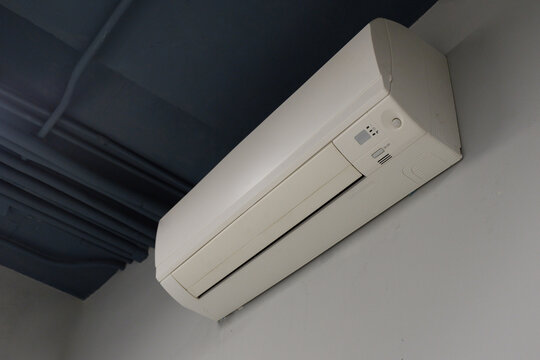 white wall mounted air conditioner on white and grey wall background, object, technology, decor, fashion, home, office, copy space