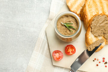 Tasty liver pate, bread and tomatoes on light grey table, top view. Space for text
