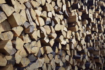 firewood stacked near the wall close-up
