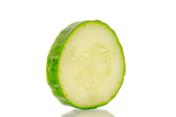 One slice of juicy smooth cucumber, macro, isolated on white background.