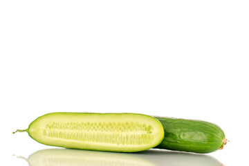 One whole and one half of a juicy smooth cucumber, macro, isolated on a white background.