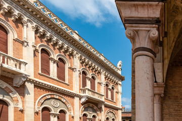 Scenic view from Piazza delle Erbe on the facade of Palazzo Della Ragione on sunny day in Padua,...