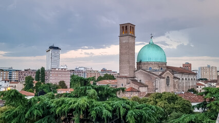 Scenic view on Basilica di Santa Maria del Carmine in Padua, Veneto, Italy, Europe. Roman Catholic church with tower in a Northern Italian city. Touristic sight seeing in Padova. The dome is green