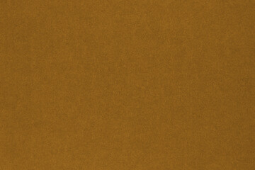 Brown colored paper texture. Сoloured background or wallpaper. Textured surface with cellulose...