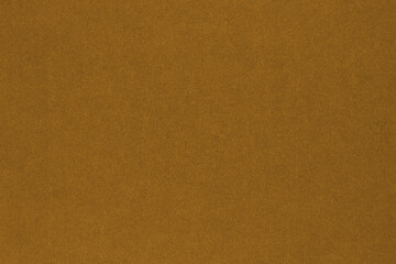 Brown colored paper texture. Сoloured background or wallpaper. Textured surface with cellulose fibers