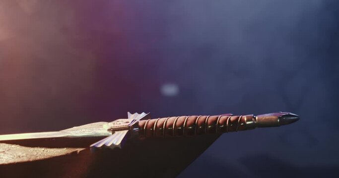 Close up of big sword forged by blacksmith. Armor of medieval times used by warriors for protecting in battles, unique handwork, smoke around in workshop. Concept of ironmongery.
