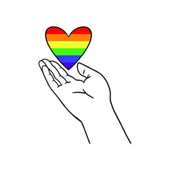 Arm holding the heart coloured in LGBT pride colours on the white background. Concept of the International Day Against Homophobia concept, sexual equality, feminism, social safety.