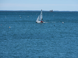the Rockland Harbor Breakwater Lighthouse in Rockland Maine on a beautiful spring afternoon