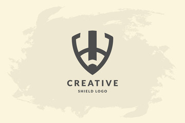 Initial letter abstract in shape of shield. Handwriting vector logo design illustration image