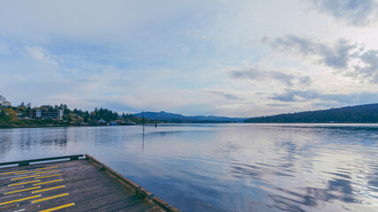 Fototapeta premium Early morning Spring view across calm Juan de Fuca Straits to Sooke Harbor, BC.