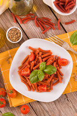 Lentil pasta with cherry tomatoes and basil.
