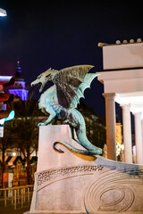 Dragon bridge and the Dragon statue in Ljubljana at night