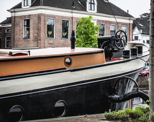 Black-orange barge bow on the canal © Joanna