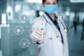Doctor shows a syringe with a vaccine .