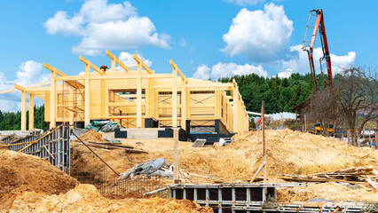 Construction of a wooden house from glued laminated timber. Double beam house constuction site....