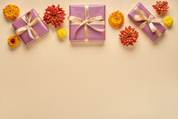 Fototapeta na wymiar Autumn , summer background with flowers and gift box. Flat lay , copy space