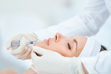 Obraz na płótnie Canvas A scene of medical cosmetology treatments botox injection.