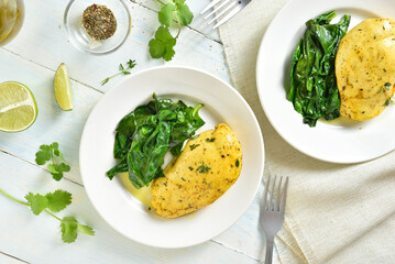 Baked turmeric chicken breast and sauteed spinach