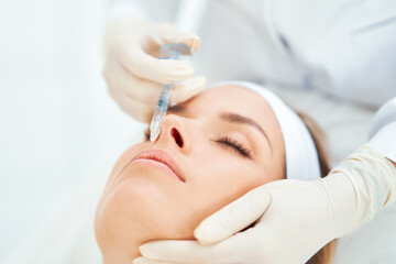 Naklejka premium A scene of medical cosmetology treatments botox injection.