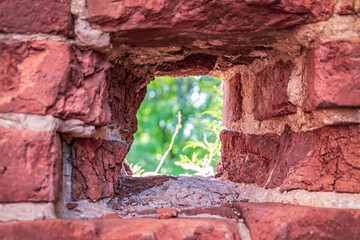 a small window loophole in the wall