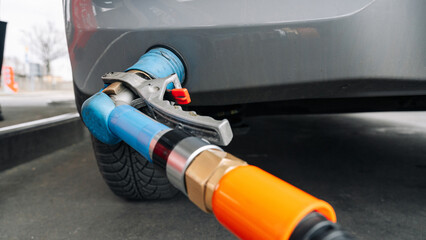 Filling car petrol. Pump gas fuel at gasoline oil station for nozzle tank. Black handle of the...