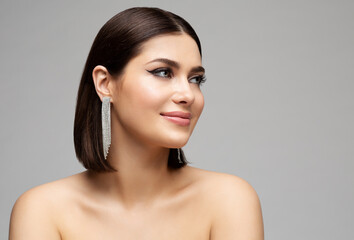 Fashion Woman Face Profile with Silver Diamond Earrings. Glamour Beauty Model with Bob Hairstyle...