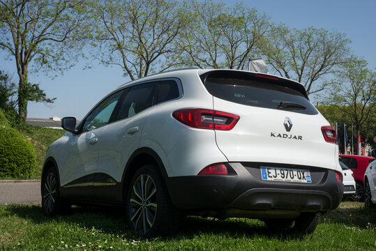 Mulhouse - France - 8 May 2022 - Rear view of white Renault Kadjar parked in the grass