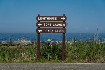 Point Lookout, Maryland USA SIgns in the National Park pointing to the lighthouse, boat launch, and park store.