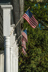 Solomons, Maryland Amercian flags hanging on a porch.