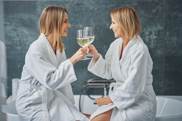 Two girls or couple in bathroom having fun