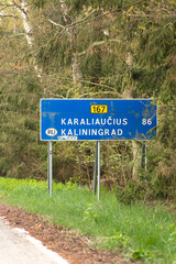 State border between Lithuania and the Russian enclave of Kaliningrad in Russia closed due to sanctions imposed by the European Union with stop sign on the empty road, vertical