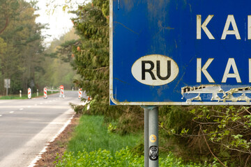 State border between Lithuania and the Russian enclave of Kaliningrad in Russia closed due to sanctions imposed by the European Union with stop sign on the empty road - obrazy, fototapety, plakaty