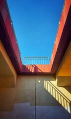 Sky visible through colorful bridge