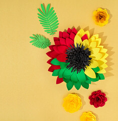 Creative background for Juneteenth African American Holiday. Handcraft flower in Pan-African colours