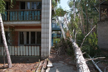 destroyed brick buildings on the territory of an old children's camp in the summer forest. Ulyanovsk