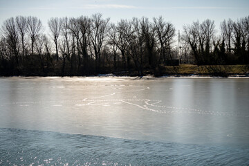 Frozen surface of Jarun lake in Zagreb city, Croatia with tracks left over by ducks and water birds