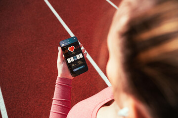 Fitness application. Smartphone screen with sport gym or fitness health mobile application. Girl...
