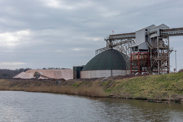 Rock salt processing plant with piles of salt