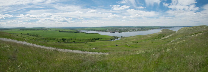 Sunny view on panorama of the Volga river. landscape with green hills and a river
