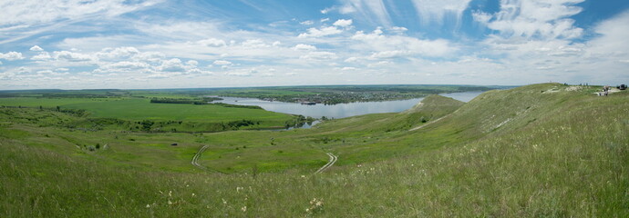 Sunny view on panorama of the Volga river. landscape with green hills and a river