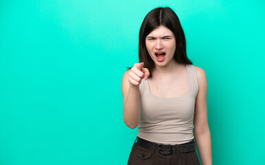 Fototapeta premium Young Russian woman isolated on green background frustrated and pointing to the front