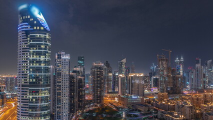 Dubai's business bay towers aerial night timelapse. Rooftop view of some skyscrapers