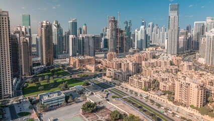Fototapeta premium Dubai's business bay towers aerial morning timelapse. Rooftop view of some skyscrapers